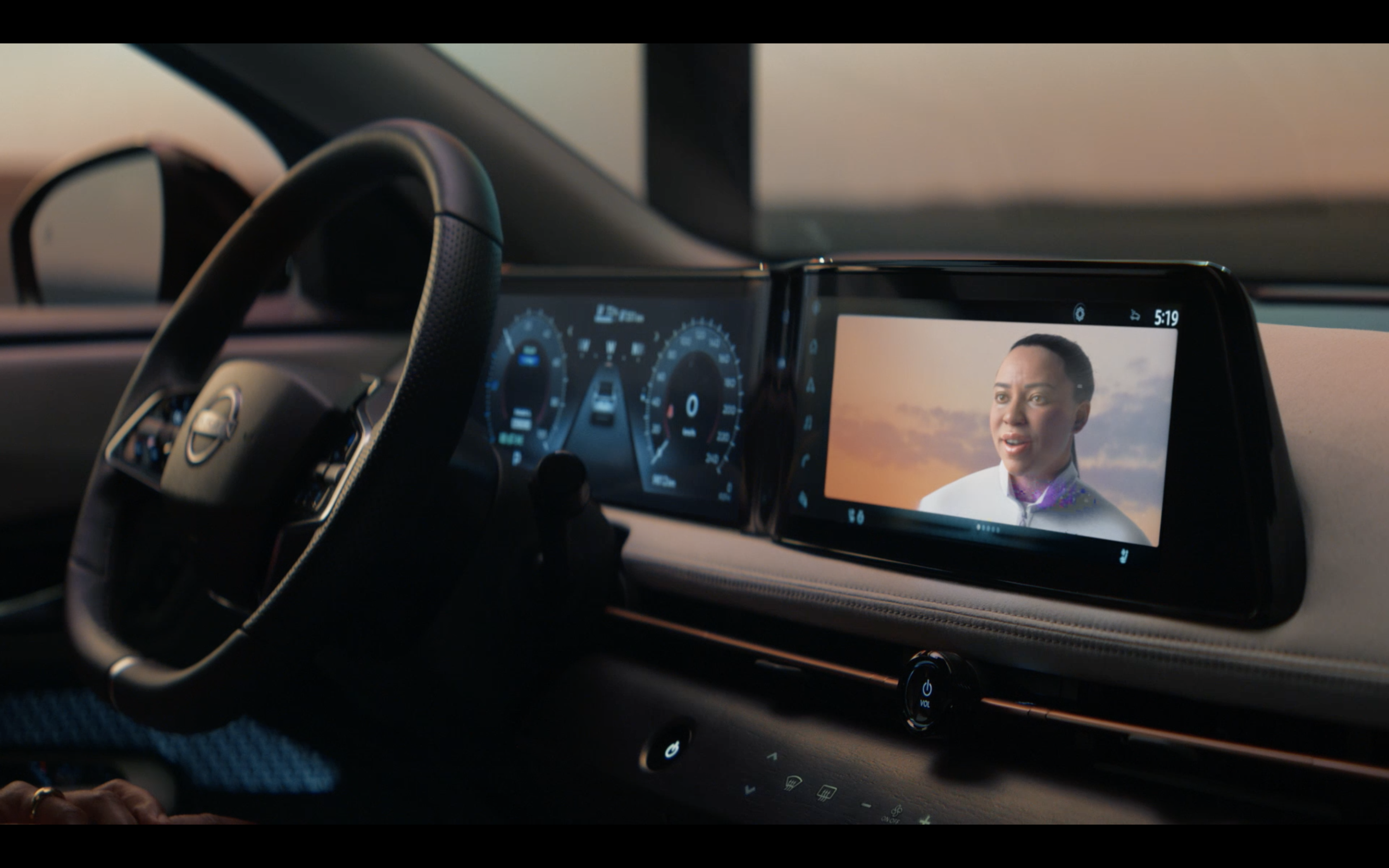 Interior of a Nissan ARIYA with a screen displaying a life-sized avatar of the driver during the AI-led experience